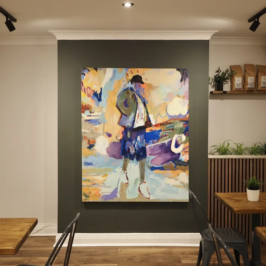 A large figurative painting hung alone on a dark green wall