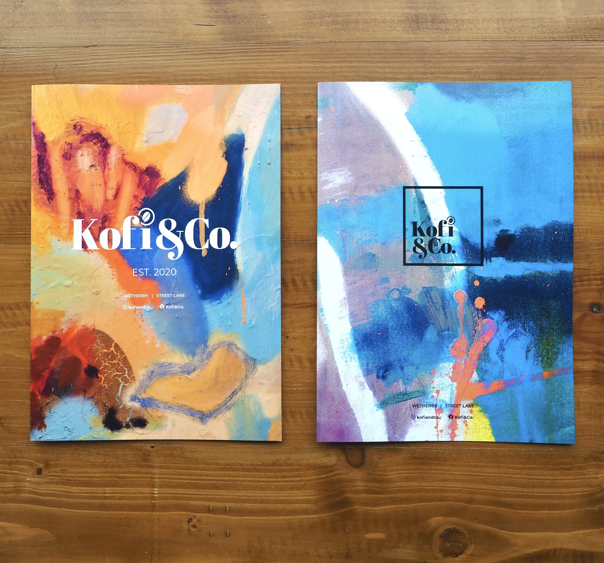 Two Kofi&Co menus with paintings used as the covers