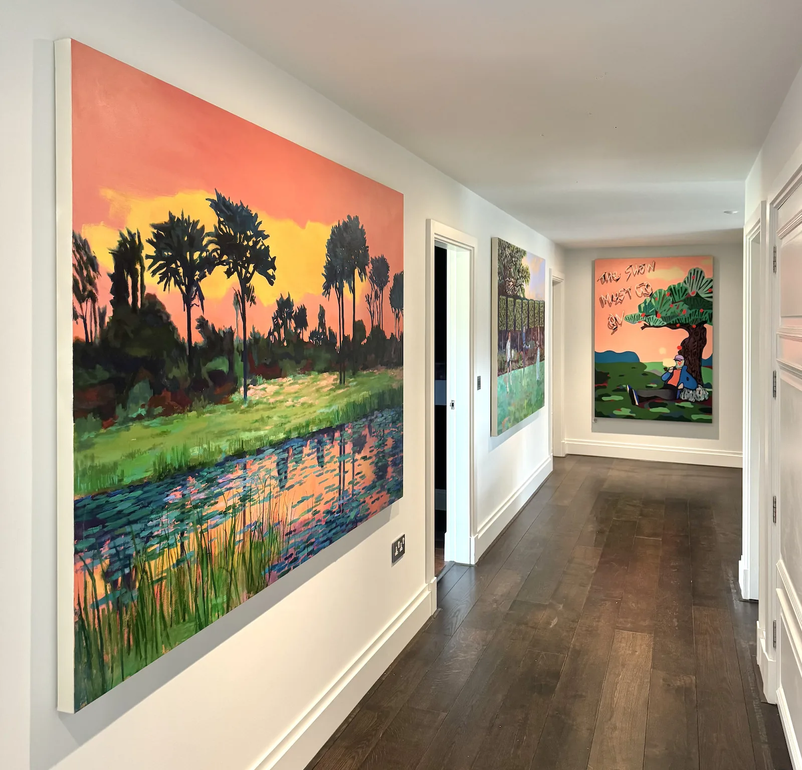 The corridor outside the children's bedrooms, three paintings hung along it