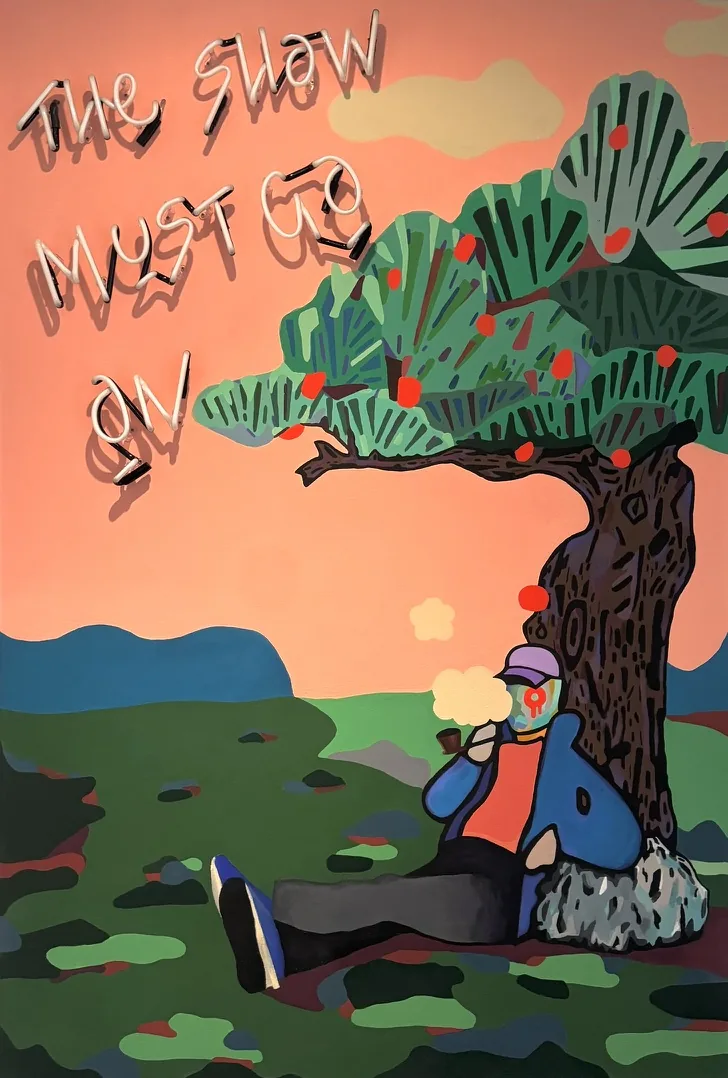 A figure in streetwear beneath an apple tree, with a glass blown neon reading THE SHOW MUST GO ON
