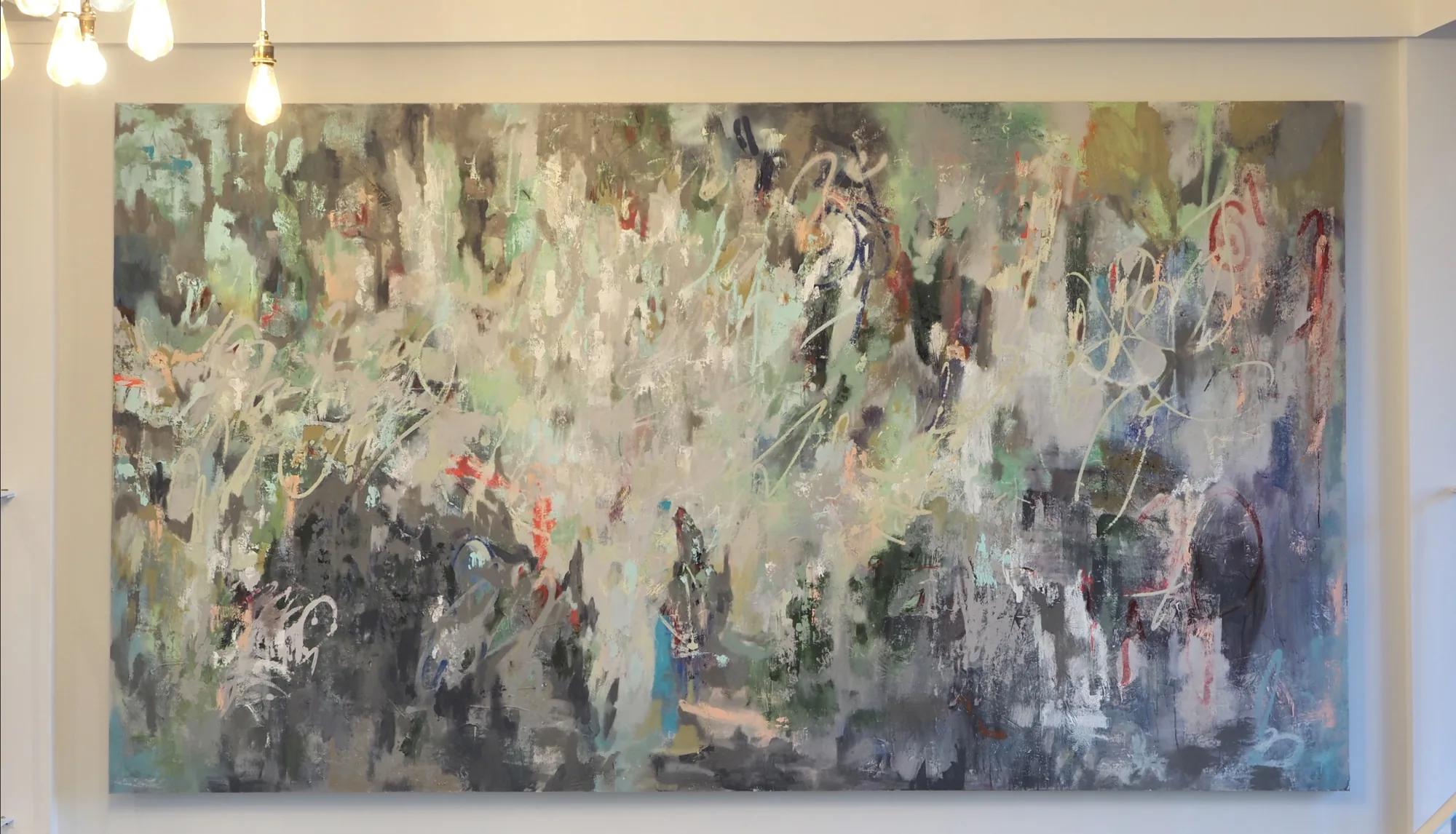 The largest work in the collection, a mixed media abstract set into the alcove in the wall