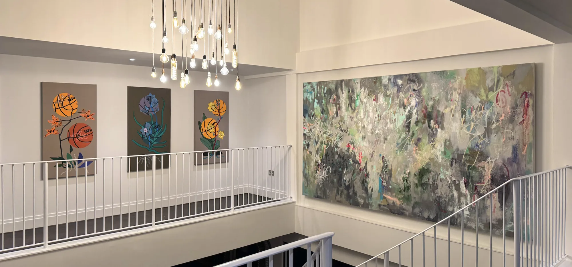 The landing, with the triptych on the left and the large abstract facing it